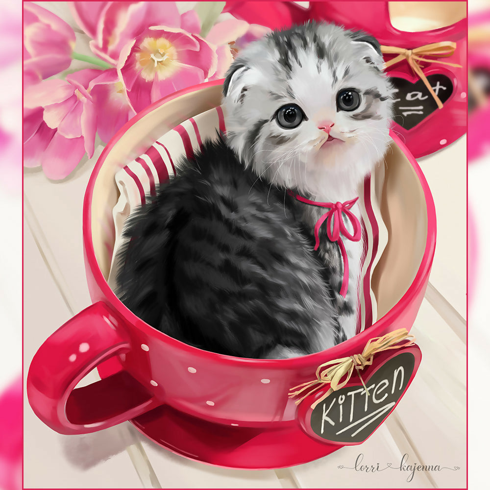 Kitten in a cup